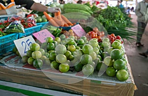 Lime pyramids on cardboard on a local farmer's market in Thailan