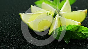 Lime segments with mint leaves