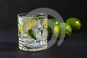 Lime slice with a sparkling water in a glass. Summer drink concept