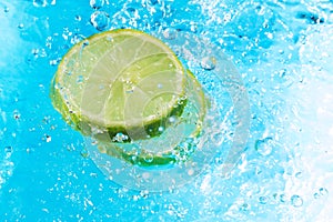 Lime splash in water, top view