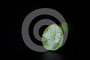Limes on black background