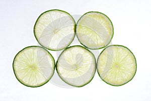 Limes slices on a bright background