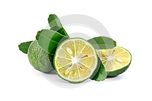 Limes with slices and leaves isolated on white background. Limes isolated