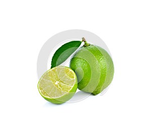 Limes with slices and leaves on white background