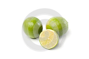 Limes on white, one cut half