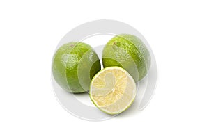 Limes on white, one cut half