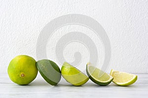 Limes on a white wood table