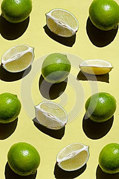 Limes on yellow background. Antioxidant Food.