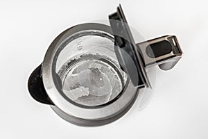 Limescale at the bottom of kettle - hard water concept photo