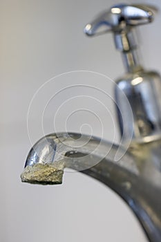 Limescale. Hard water calcification of a tap.