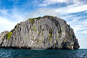 Limestone cliff island off Miniloc Island, El nido region of Palawan in the Philippines photo