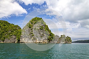 Limestone cliff on Lahus Island beach, Caramoan, Camarines Sur Province, Luzon in the Philippines