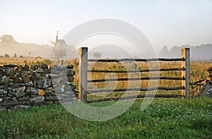 Limestone fence and misty landscape.TN