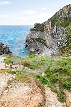 Limestone Foldings on Stair Hole Chalk Cliffs and Atlantic Ocean photo