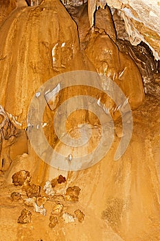 Limestone formations on the wall of an underground cave.