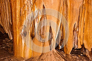Limestone formations on the wall of an underground cave.