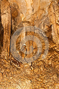 Limestone formations on the wall of an underground cave.