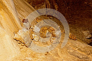 Limestone formations on the wall of an underground cave.