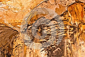 Limestone formations on the wall of an underground cave.