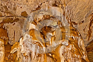 Limestone formations on the wall of an underground cave.