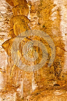 Limestone formations on the wall of an underground cave.