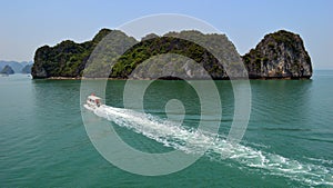 Limestone karst with cruise day boat Halong Bay