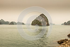 Limestone karst island and shore in Ha long Bay, Vietnam