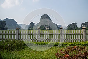 Limestone Landscape with Rice Paddies and Fence, Mua Caves