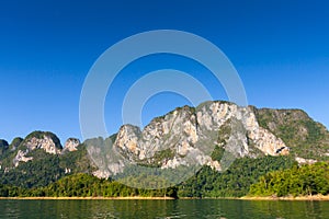 Limestone Mountain and morning mist and beautiful view neture in the Cheow Lan dam Khao Sok National Park, Thailand