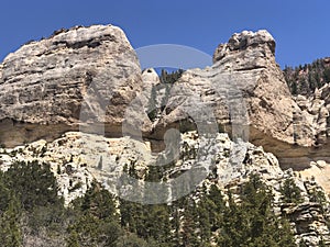 Limestone rock formation with pine tress. Southern Utah