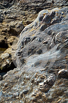 Limestone schist twisted layers form the bank of Guadiana river at Pulo do Lobo. Alentejo, Portugal