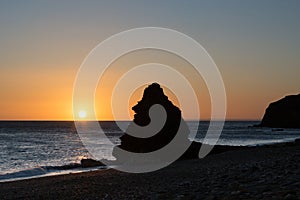 Limestone Stack on the beach at sunrise