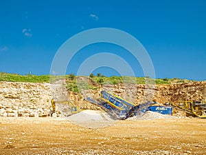 Limestone Stone Quary and an excavator.