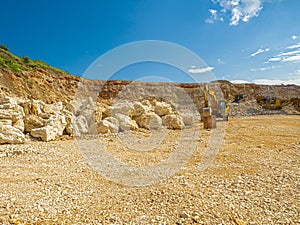 Limestone Stone Quary and an excavator.