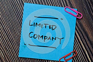 Limited Company write on sticky notes isolated on office desk photo