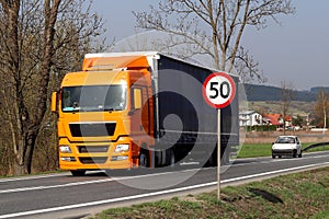 Limiting the speed of traffic to 50 km/h. Road sign on the highway. safety of traffic. Motor transportation of passengers and carg