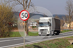 Limiting the speed of traffic to 50 km/h. Road sign on the highway. safety of traffic. Motor transportation of passengers and carg