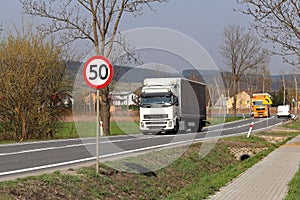 Limiting the speed of traffic to 50 km/h. Road sign on the highway. safety of traffic. Motor transportation of passengers and carg