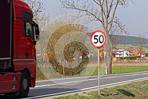 Limiting the speed of traffic to 50 km/h. Road sign on the highway. safety of traffic. Motor transportation of passengers and carg