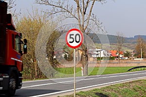 Limiting the speed of traffic to 50 km/h. Road sign on the highway. safety of traffic. Motor transportation of passengers and carg