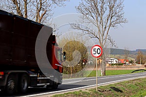 Limiting the speed of traffic to 50 km/h. Road sign on the highway. safety of traffic. Motor transportation of passengers and carg