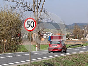 Limiting the speed of traffic to 50 km/h. Road sign on the highway. safety of traffic. Motor transportation of passengers and carg