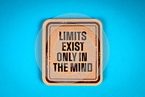 LIMITS EXIST ONLY IN THE MIND. Cardboard sticker with text on a blue background