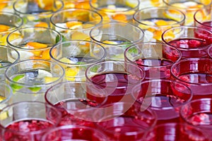 Limonade in glasses, orange lim, raspberry juice in fress water