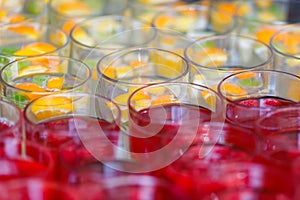 Limonade in glasses, orange lim, raspberry juice in fress water