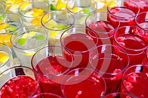 Limonade in glasses, orange lim, raspberry juice in fress water