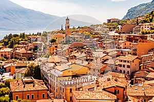 Limone Sul Garda cityscape on the shore of Garda lake surrounded by scenic Northern Italian nature. Amazing Italian cities of