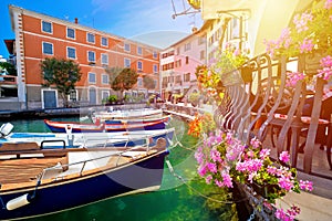 Limone sul Garda turquoise waterfront sun haze view