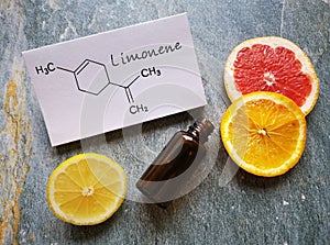 Limonene essential oil with structural chemical formula of limonene. Citrus fruit lemon, grapefruit, orange, spa concept
