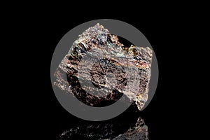 Limonite or brown iron ore, raw rock on black background, mining and geology